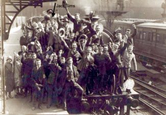 Jack Sims indicated on this group photo in UK ready to embark on his ship to New Zealand. Photo probably at at Southampton docks.