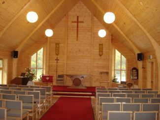 A view inside the church showing all fittings, carpet and chairs, ready for worship. | Ken Jones