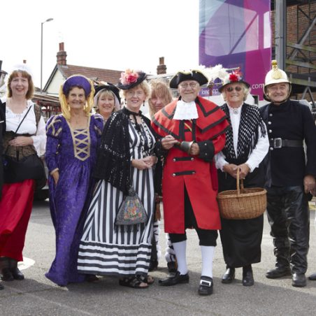 Characters from Hadleigh's past gather about the Town Crier. It takes all sorts, from marauding Saxons looking for a place to settle to fine ladies from the Castle Court and latterday fire fighters in all their brassy finery. Characters from Hadleigh's past gather about the Town Crier. | Tessa Hallmann