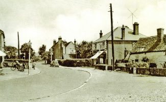 The shops between the White Hart and the old Hart Cottages The shops between the White Hart and the old Hart Cottages | H.& T. C. Archive