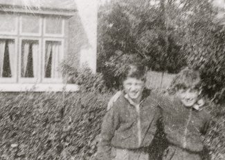 My younger brother and me outside Kate Cooper's house. | David Guy