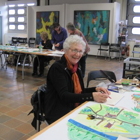 Creating the banners HOFS Engine bay humming as needle and thread used to make the banners | Lynda Manning