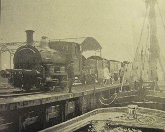 The railway engine at the wharf having crossed the railway line. The railway engine at the wharf having crossed the railway line.