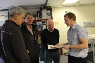 David Hurrell, Terry Barclay and Malcolm Brown shown an early print by David Button (4 Edge Limited MD) David Hurrell, Terry Barclay and Malcolm Brown shown an early print by David Button (4 Edge Limited MD) | Graham Cook
