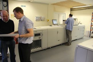The Océ Digital Printing Press is in the background The Océ Digital Printing Press is in the background | Graham Cook