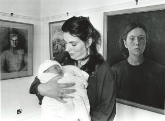 Julia and son in 1985, in front of her self portrait | By courtesy of  Newsquest Essex Echo & Gazette