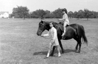 Elaine leading Alison Lindoe on pony on Thundersley Common Elaine leading Alison Lindoe on pony on Thundersley Common | Alison Lindoe