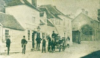 Hoy Inn before road widening. Between the Hoy and the now missing houses we can just glimpse the dark box of the smithy